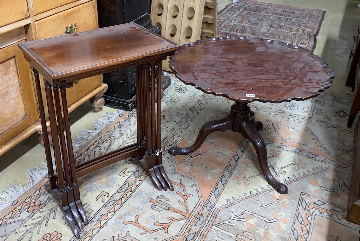 A George III and later circular piecrust occasional table, cut-down, diameter 70cm, height 50cm together with a nest of three Edwardian mahogany tea tables